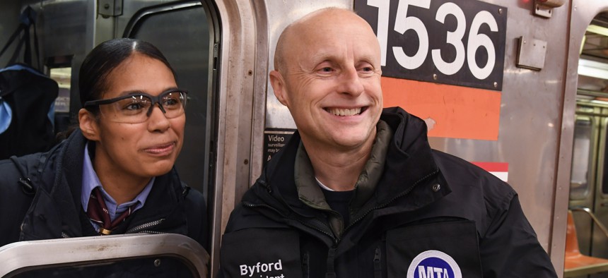 Then-New York City Transit President Andy Byford poses with a train conductor on New Year’s Eve in 2019.