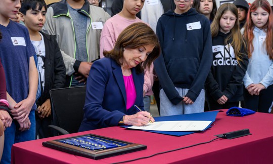 Gov. Kathy Hochul signs the state budget into law on May 9, 2025.