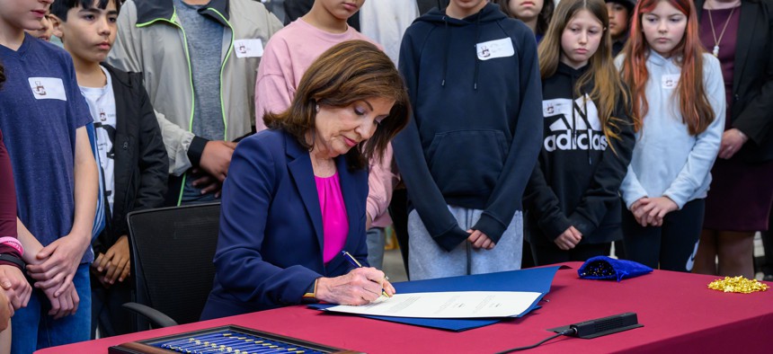 Gov. Kathy Hochul signs the state budget into law on May 9, 2025.