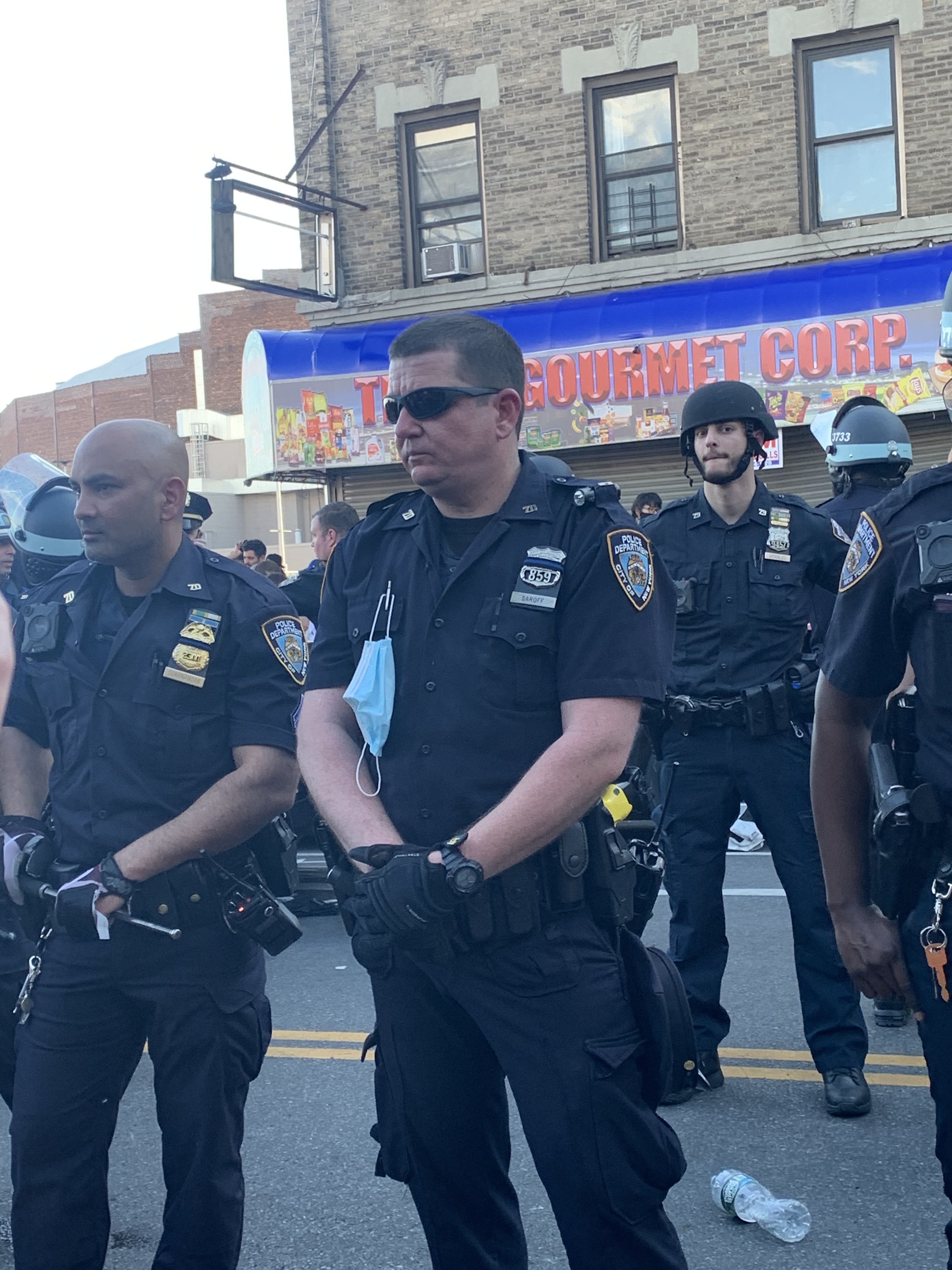Maskless NYPD officers at a protest in Flatbush on Saturday. Maskless NYPD officers at a protest in Flatbush on Saturday.