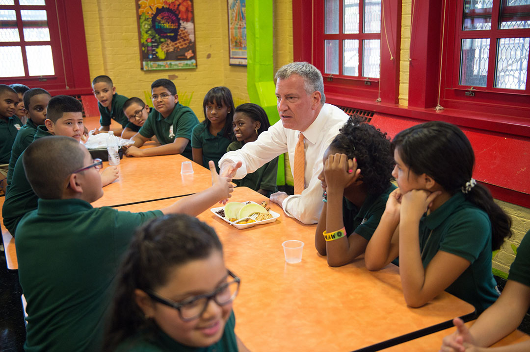 Mayor Bill de Blasio enjoys lunch with students at school. Mayor Bill de Blasio enjoys lunch with students at school.