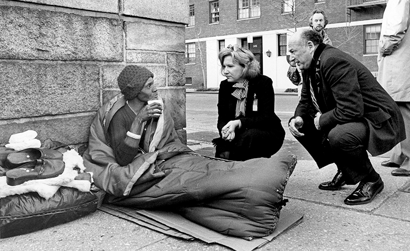 Ed Koch with homeless man