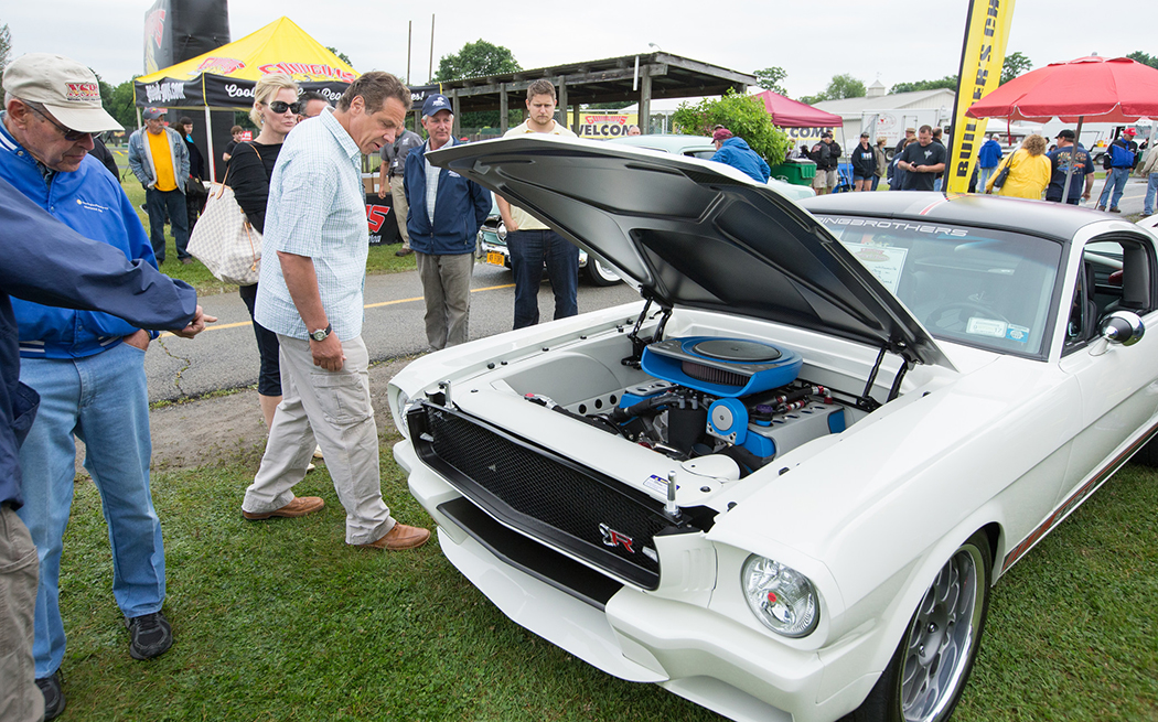 Andrew Cuomo looking at a car Andrew Cuomo looking at a car