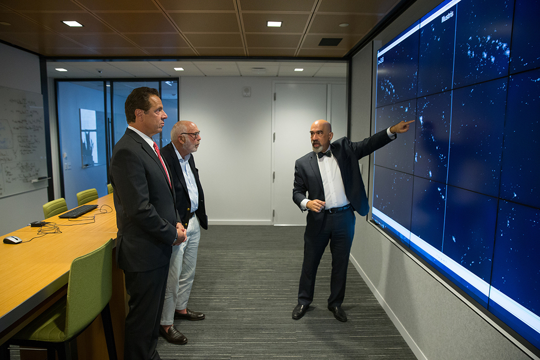 Andrew Cuomo looking at a screen Andrew Cuomo looking at a screen