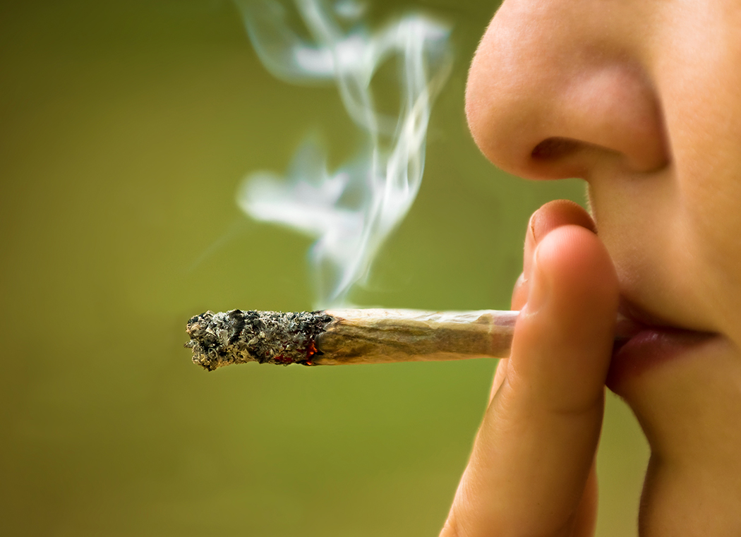 Girl smoking weed closeupi Girl smoking week closeup