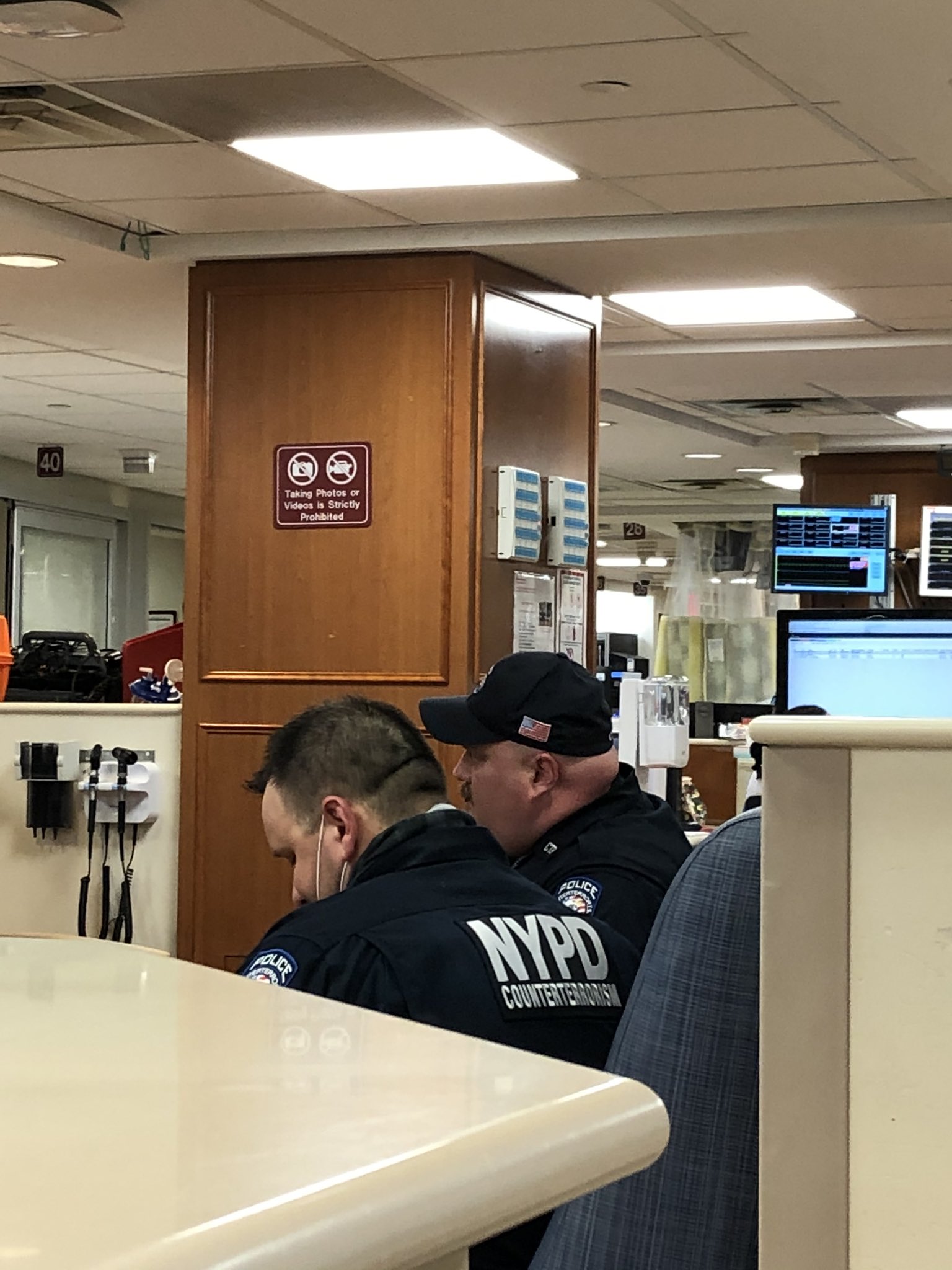 Unmasked NYPD officers at the ER. Unmasked NYPD officers at the ER.